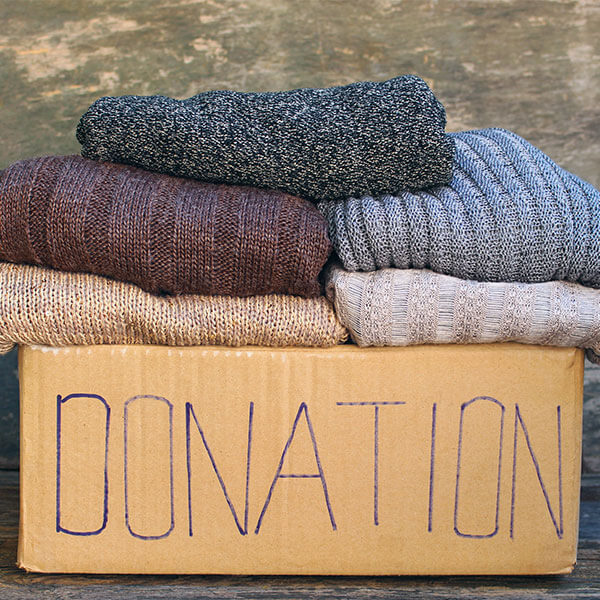 Clothes in box labeled "Donation"