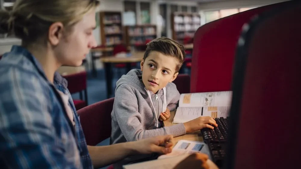 A BIG mentoring a kid